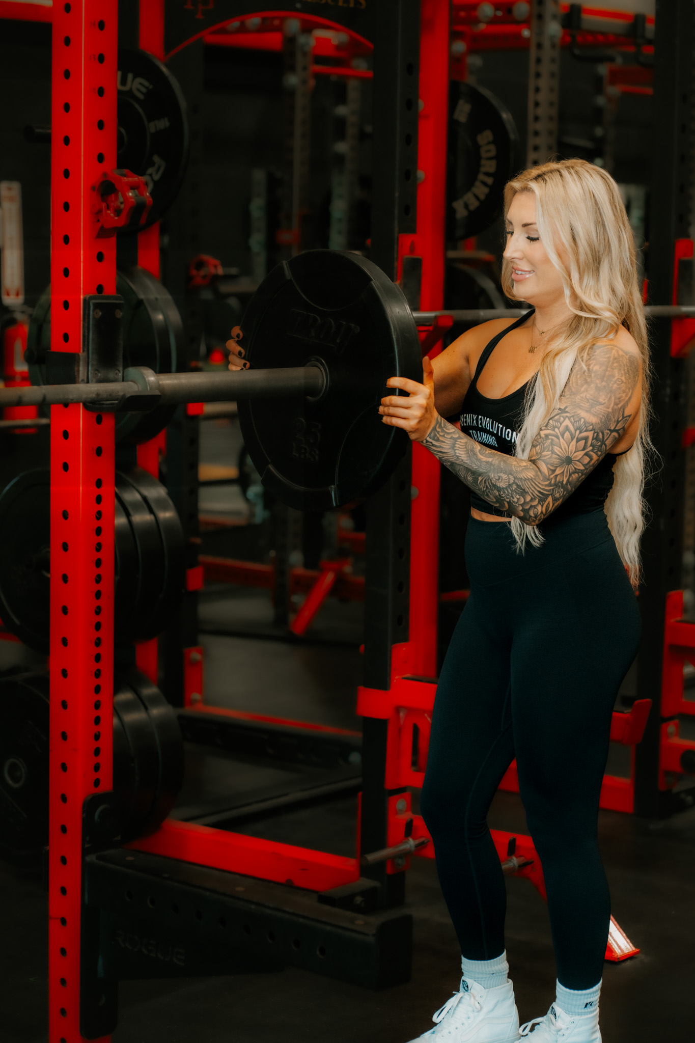 Coach Jamie loading the barbell